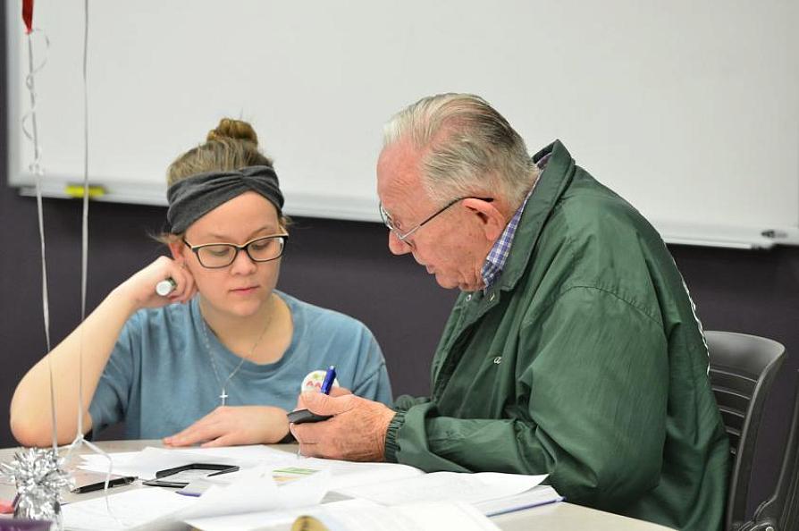 faculty member working with a student