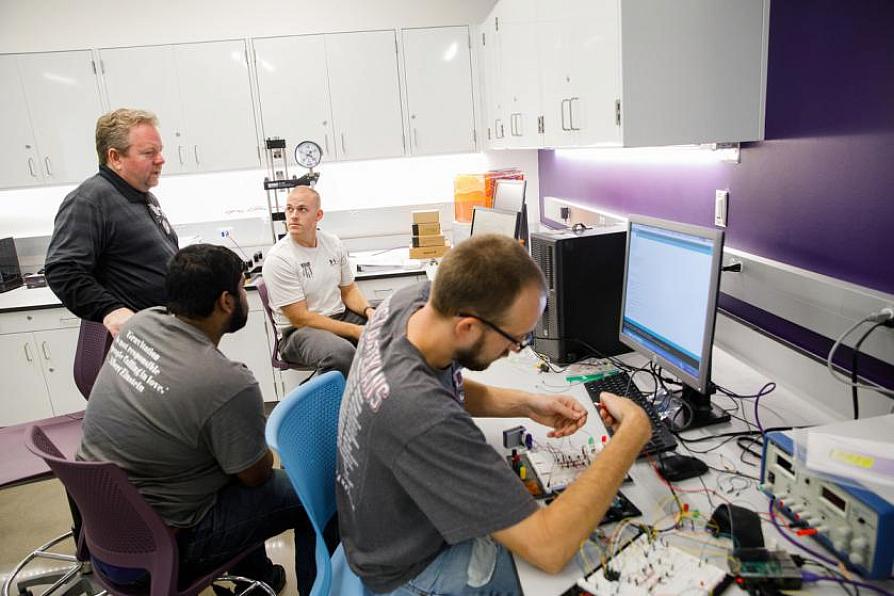 students performing research with faculty supervision