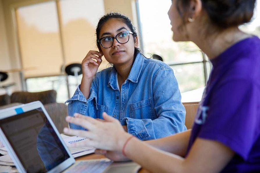 students engage in a discussion