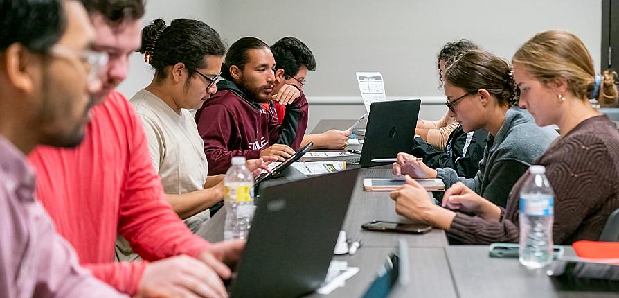 students collaborating with pursuing their music degrees