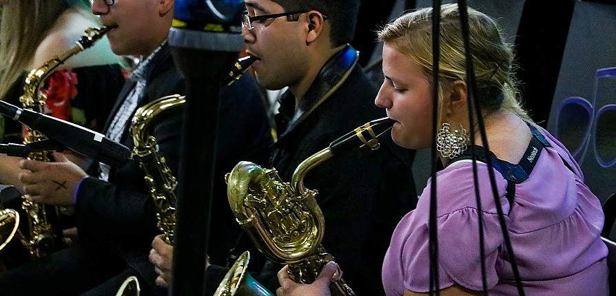 Group of people playing saxophone