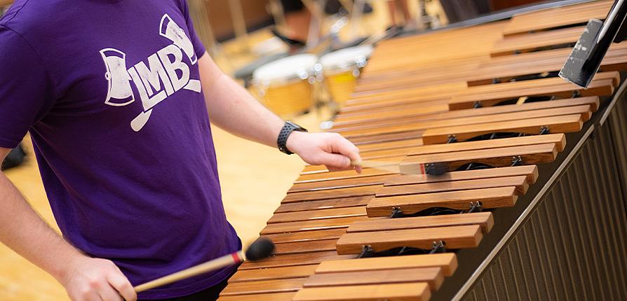 student playing marimba
