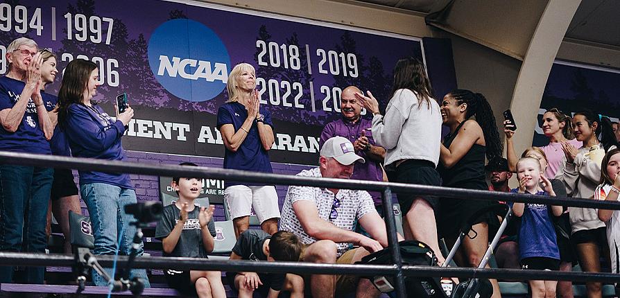Debbie Humphreys, center, stands in amazement after the newly dubbed Debbie Humphreys Court was unveiled in Shelton Gym May 3, 2025. Humphreys currently has the second most wins among active coaches with 846 and is the only coach with at least 800 wins at one institution.
