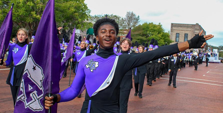 Members of the LMB march in a parade