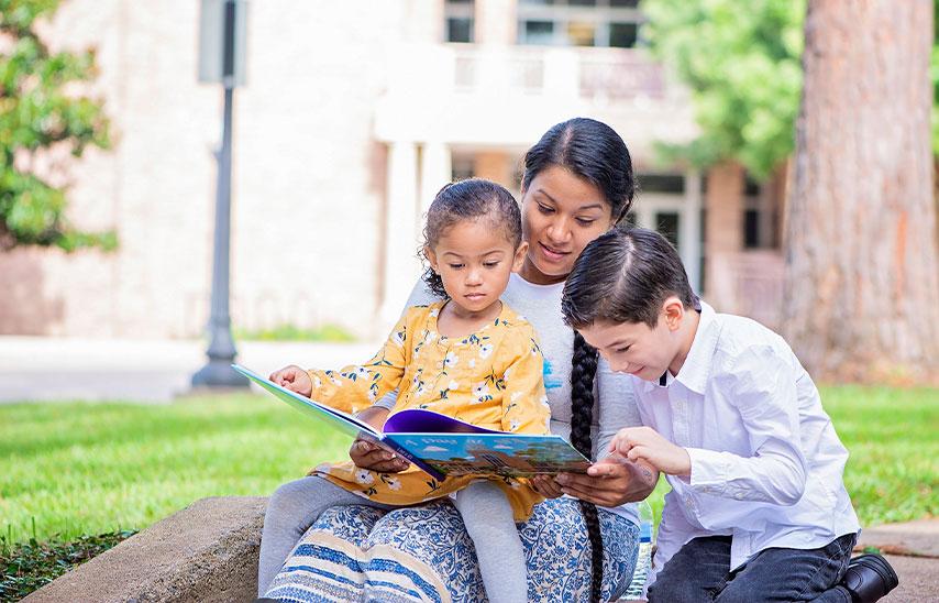 Hermelinda "Hennii" Céspedes '17 & '21 and her two children