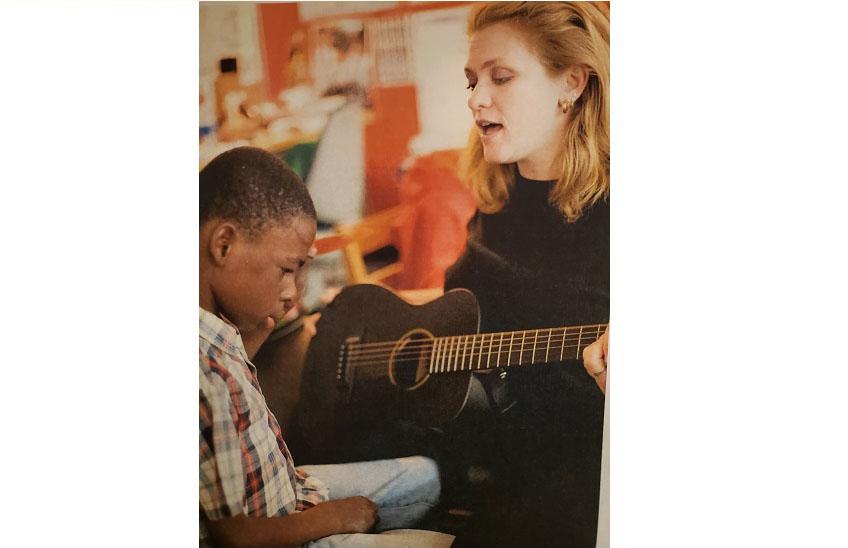 Dr. Shannon Darst playing guitar