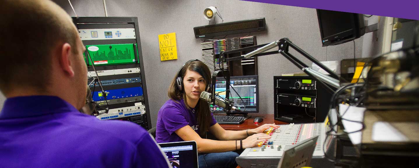 SFA mass communication student at microphone