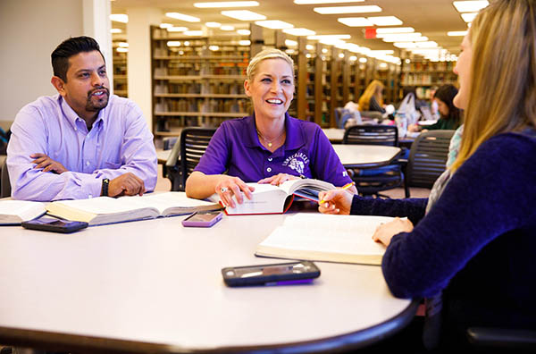 students working on their masters degree online