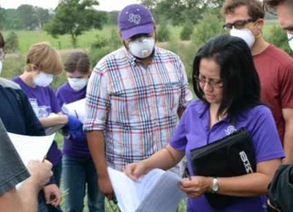 Dr. Jerez with students outdoors