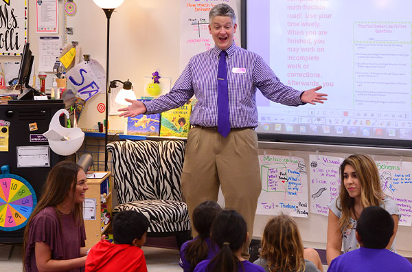 Professor interacting with children