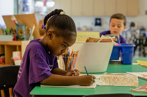 Child focused on writing
