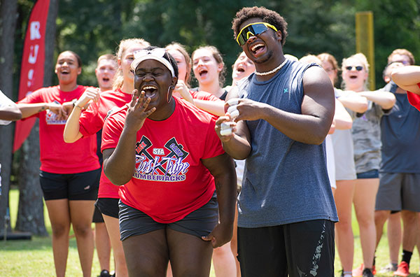 Students laughing at Jack Camp