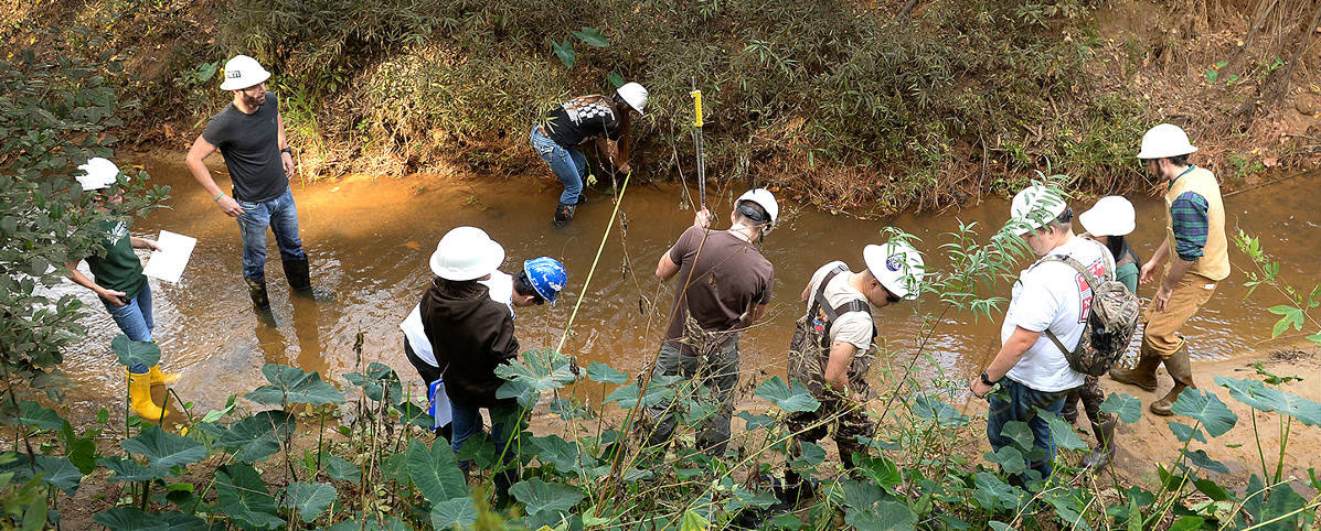 students conducting hydrology (one of our forestry programs) research in a creek