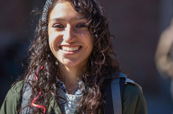 Student outside smiling