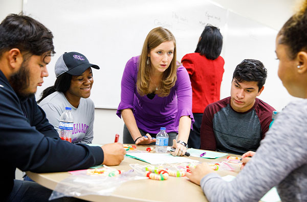 Dr. Nikki Shoemaker talking with students