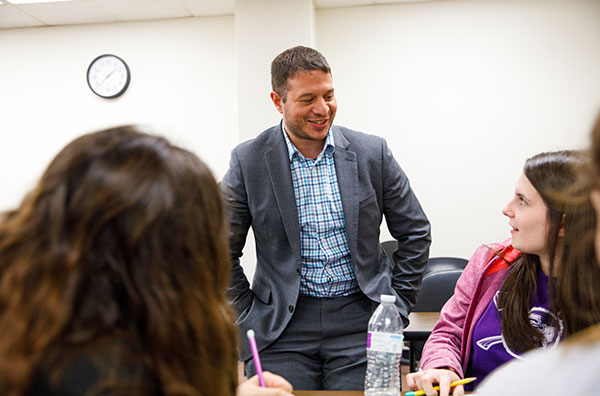 Dr. Jay Vega talking with students