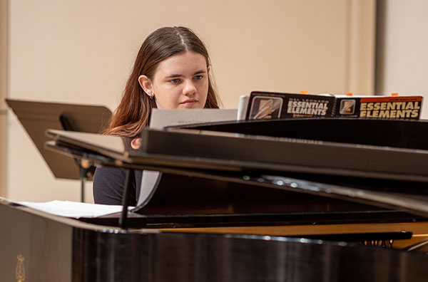 Student playing piano