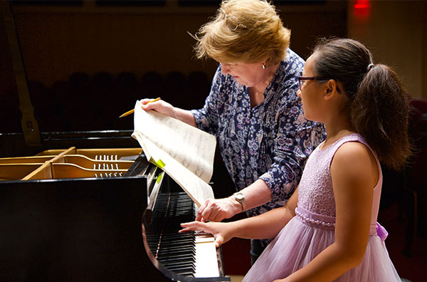 Student receiving instruction from teacher