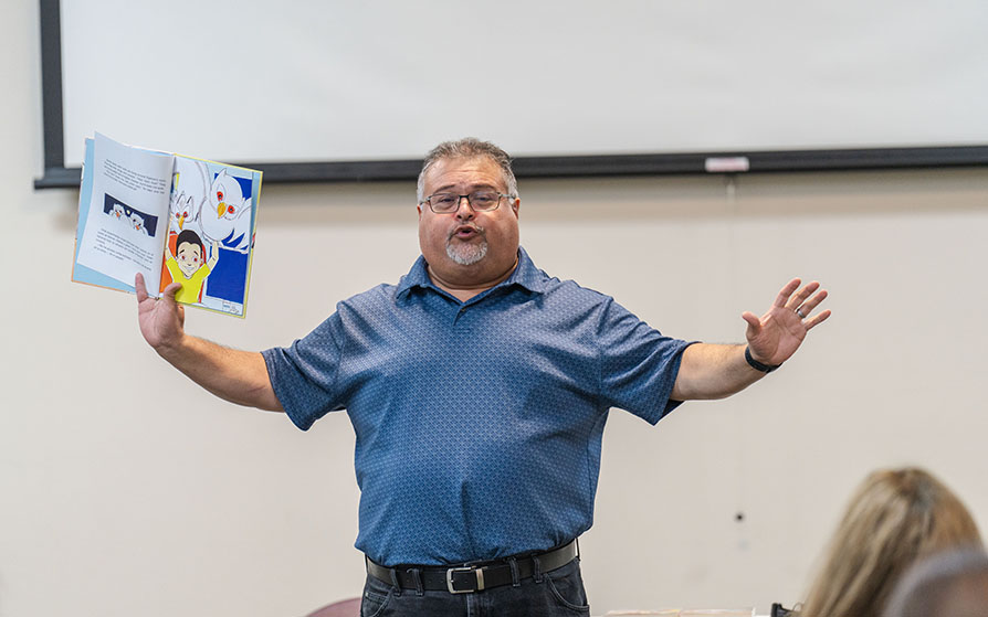 Author Xavier Garza presenting at the Back to School Bash event