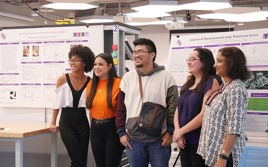 Chemistry students with their research projects