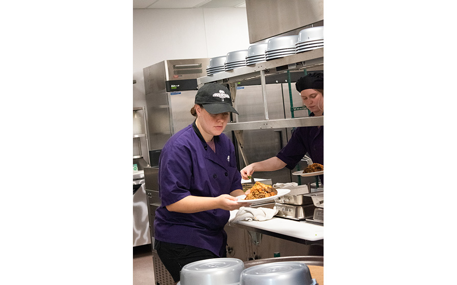 Student working in the kitchen