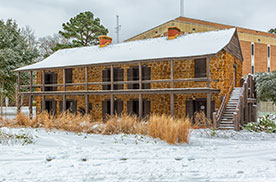 Stone Fort Museum in winter with snow