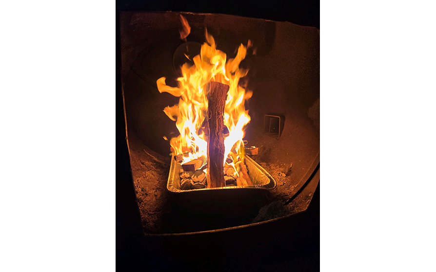 Firing up the BBQ pit