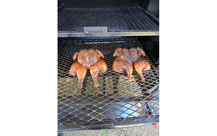 Chicken cooking on the pit