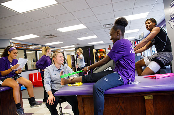 student exercising on top of table