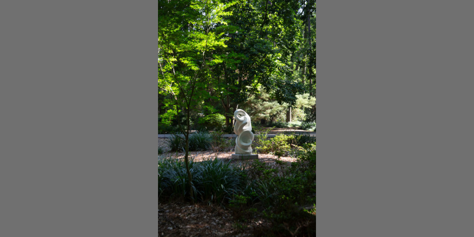 An organic sculpture with a curvolinear profile in the SFA Gardens