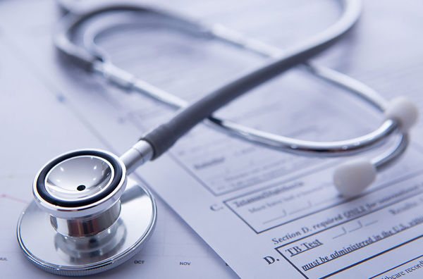 stethescope lying on medical form