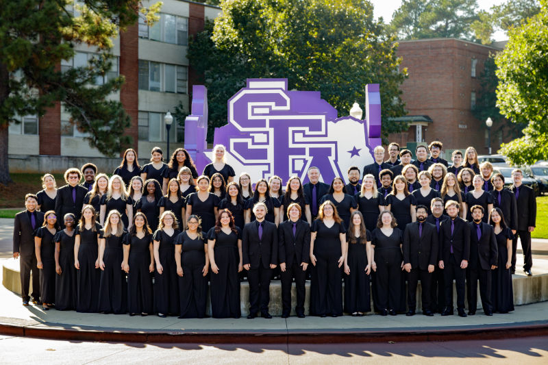 Members of the SFA gather in front of the SFA Spirit statue