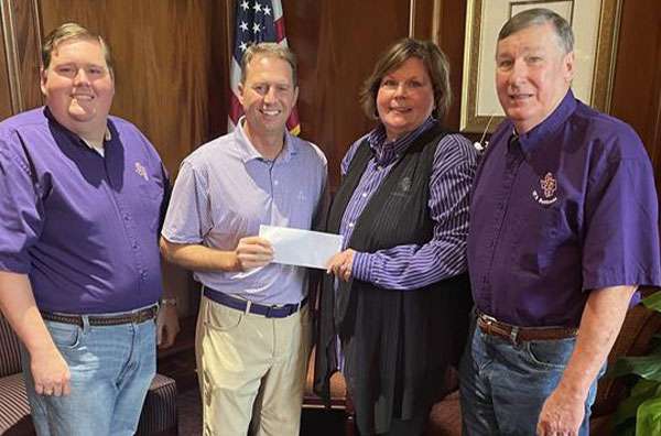 The McClure-Franklin family established the McClure-Franklin Family Scholarship with the inaugural recipient declared in fall 2024. Pictured, from left, is Tanner Franklin, SFA President Neal Weaver, Dr. Geralyn McClure Franklin and Kenny Franklin