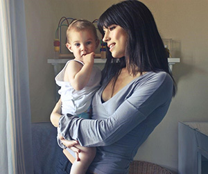 mother holding baby