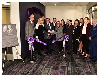 The SFA Nelson Rusche College of Business hosted a dedication for the Arnold Center for Entrepreneurship in January. The center is named for Greg Arnold of Dallas, who received a Bachelor of Business Administration in marketing from SFA in 1987. Arnold is CEO of TAC - The Arnold Companies. Celebrating at the ribbon cutting are, front row, from left, Dr. Steve Westbrook, SFA president; Ashley and Greg Arnold, ACE benefactors; Karen Gantt, SFA Board of Regents chair; Jennifer Wade Winston, board secretary; Brigettee Carnes Henderson, regent; Paige Vadnais, student regent; and Robert Flores, regent. Back row, from left, are Dr. Tim Bisping, Rusche College of Business dean; David Alders, regent; Judy Larson Olson, regent; Nancy C. Windham, regent; and Laura Rectenwald, regent. Photo by Hardy Meredith '81
