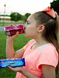 child eating and drinking snacks