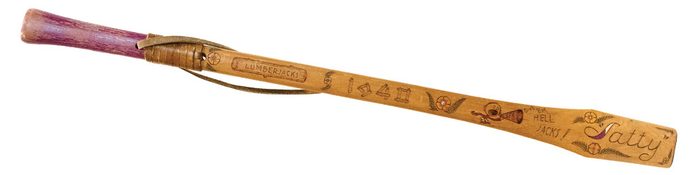 A former Sawyers member’s axe handle on display in the East Texas Research Center features detailing that shows the time and effort SFA students put in to decorating their axe handles. Photo by Lizeth Garcia