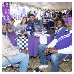 Alumni sitting at table