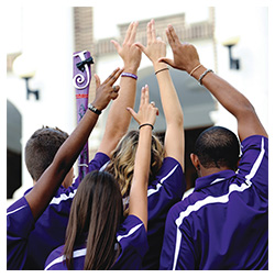Students holding up the Axe 'Em, Jacks hand sign