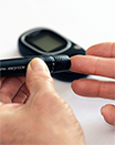 person testing their blood sugar