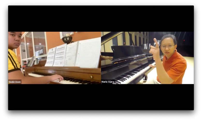 SFA music professor Mario Ajero instructs student Gezle Uson in an online Zoom session.
