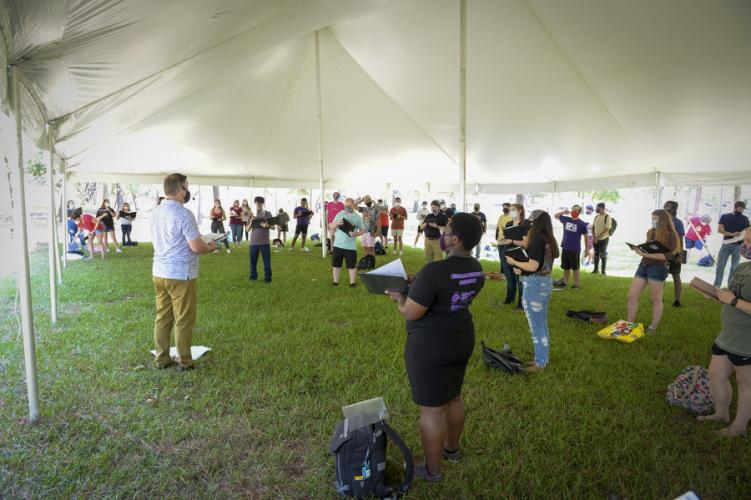 photo of SFA choral students following CDC protocols