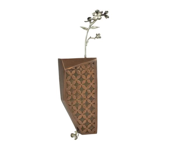 a photo of Selden's work “Interlaced Inclusion,” copper, sterling silver, 2.25” x 8” x 1.5”