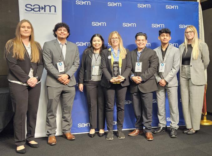 the SFA chapter of the Society for Advancement of Management competing members with Dr. Gina Harden, faculty advisor for the group