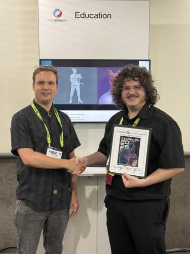 Malachiyah Armstrong being awarded first place in the international 2026 ACM SIGGRAPH SpaceTime competition.