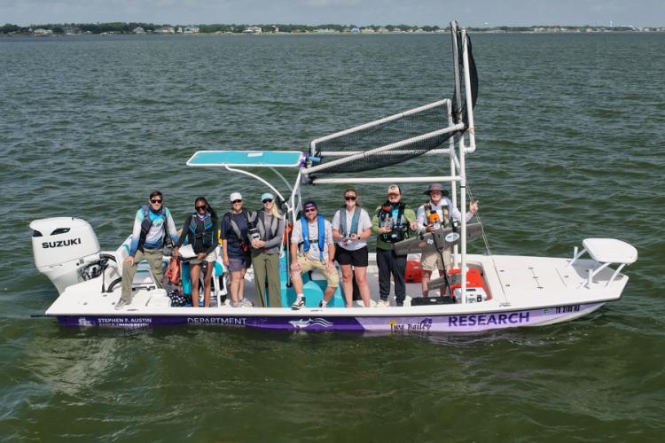 Pictured aboard the Iwa Bailey, from left to right, are Sean Murphy, political science senior from Nacogdoches; Ryleigh Wilson, biology senior from Dallas; Kristi Fazioli, scientist with the Galveston Bay Dolphin Research Program; Ellie Maus, intern with the Galveston Bay Dolphin Research Program; Dr. Jason Bruck, associate professor of biology at SFA; Callie Lynn, biology graduate student from Rusk; Daniel Gassen, PHASM pilot and aerospace engineer at the Oklahoma Aerospace Institute for Research and Educa