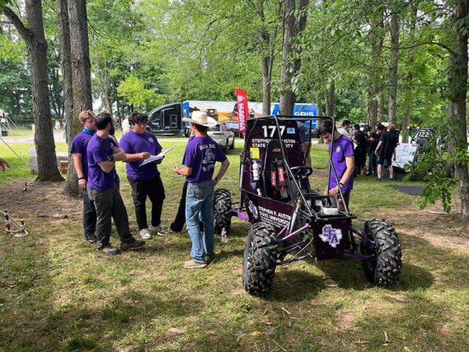 The SFA Baja SAE team during off-road Baja vehicle inspection