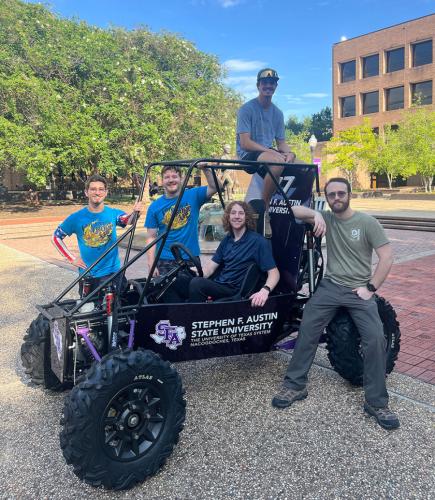 The SFA Baja SAE team with their off-road Baja vehicle
