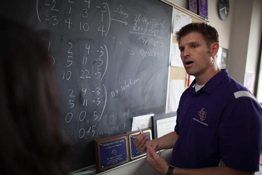 faculty member working with students